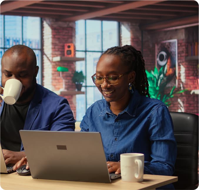 People collaborating at laptops